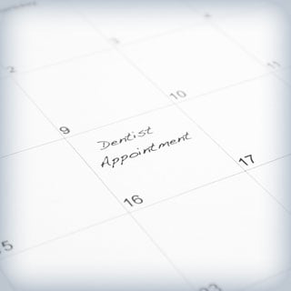 'Dentist appointment' written on a calendar